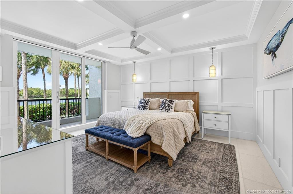 Guest bedroom with ensuite bath, balcony, and a lovely view of the pond