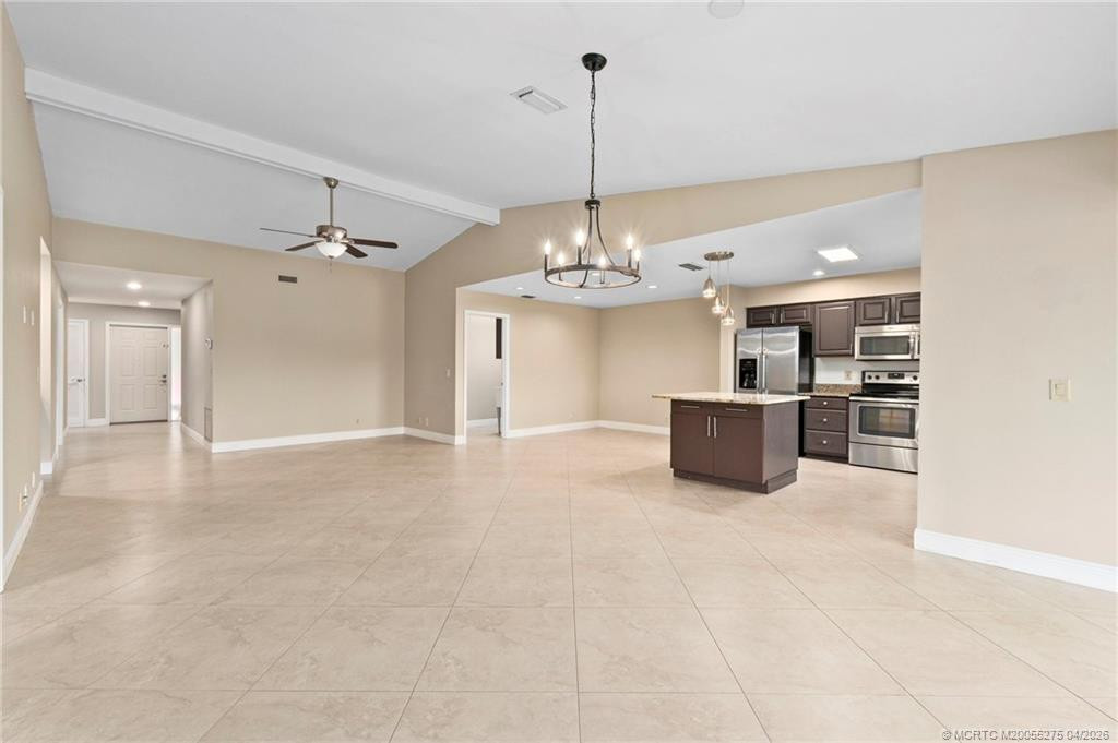 Open concept Kitchen, living and dining. at 3281 SW Bobalink Way, Palm City
