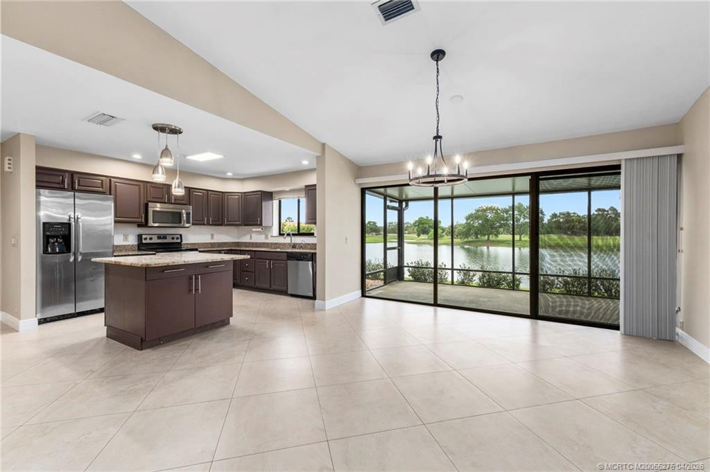 Triple slider to porch. at 3281 SW Bobalink Way, Palm City
