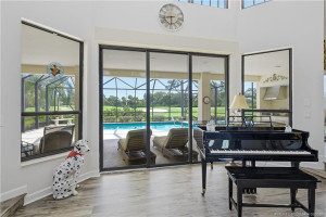 Vista outside dining room, pool then golf course