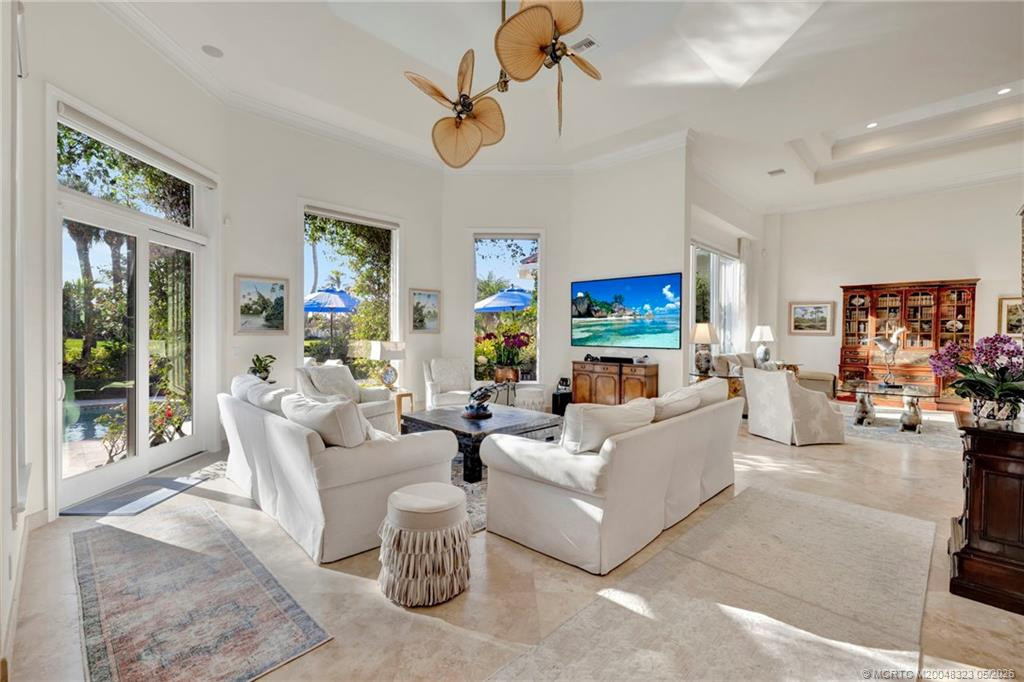 Family room flows seamlessly to the living room, ideal for entertaining a crowd or intimate gatherings