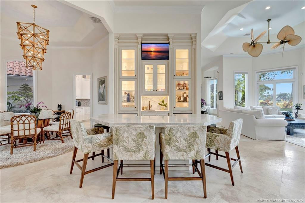 Entertainment bar with wine cooler, 2 beverage drawers and ice maker. Perfect for game day!