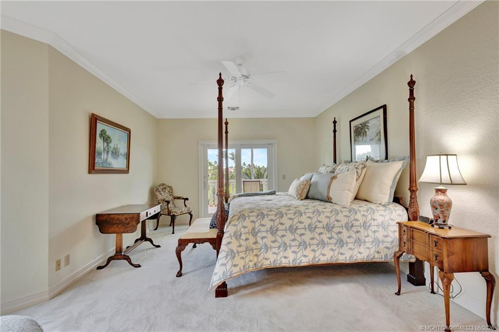 Upper level guest ensuite with covered balcony provides sunset and golf course views