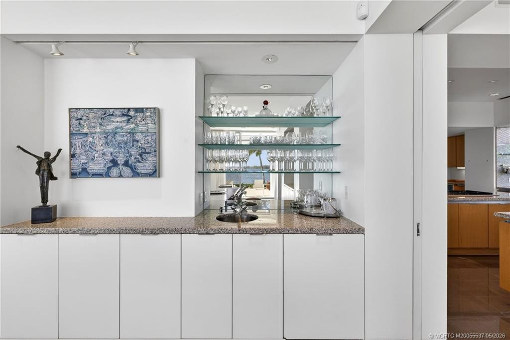 Entertain with ease with this bar in the dining area, adjacent to the kitchen