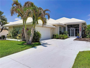 Side entry 2 car garage with screened in front patio. Yard is part of the association fee. 2019 Roof concrete tile roof. association power washes the the roof once a year. The house will get power washed every 7 Years.