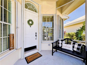 Front screened patio before entering your home. accordion shutters.
