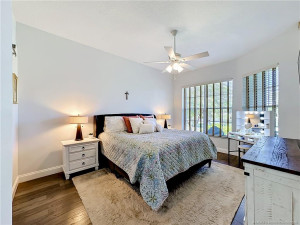 Looks out over the water and golf course. Look at the details. To theft it flows into the primary bathroom inside the bedroom.