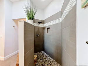 This is connected to the primary bedroom with this custom large shower all updated. With double sinks and 2 closets . What a beauty.