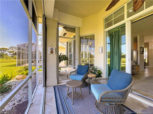 Screened patio in rear of home with accordion shutters, sliders lead into the great room and kitchen.