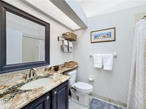 This is the guest bathroom with tub and shower together with a skylight.