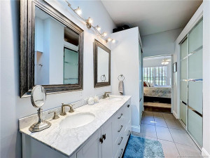 Double sinks, 2 closets, large walk-in shower.