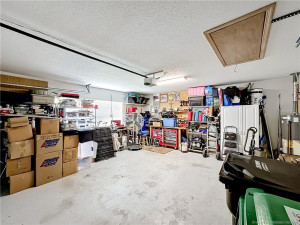 Pull downstairs, pull downstairs for extra storage in the attic, garage door opener, gas hot water heater,