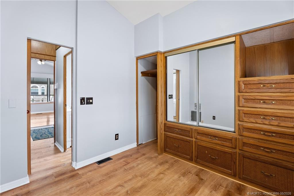 Bedroom with opening for stacked washer/dryer