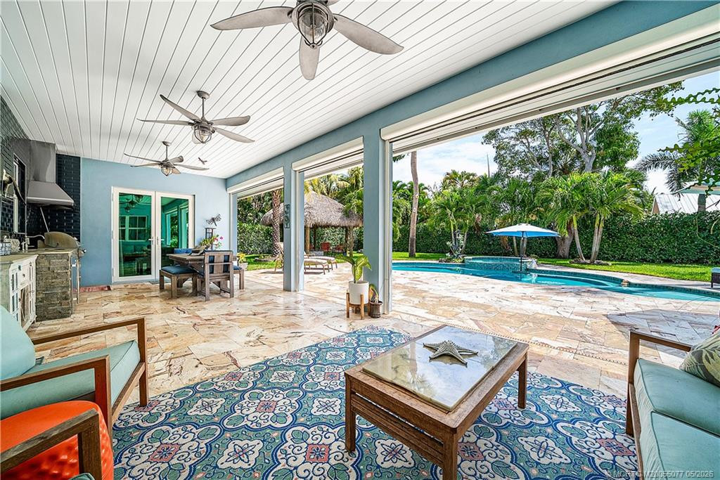 Lanai with electric roll-down hurricane screens.