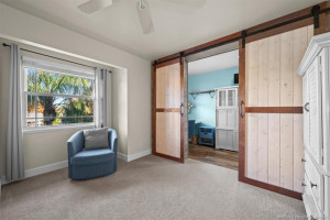 Guest Bedroom with additional space behind barndoors