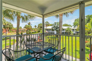 Expansive screened lanai offers the perfect setting to enjoy tropical breezes, lush palm views, and relaxing water and pool vistas. Ideal for morning coffee, evening cocktails, or year-round outdoor living