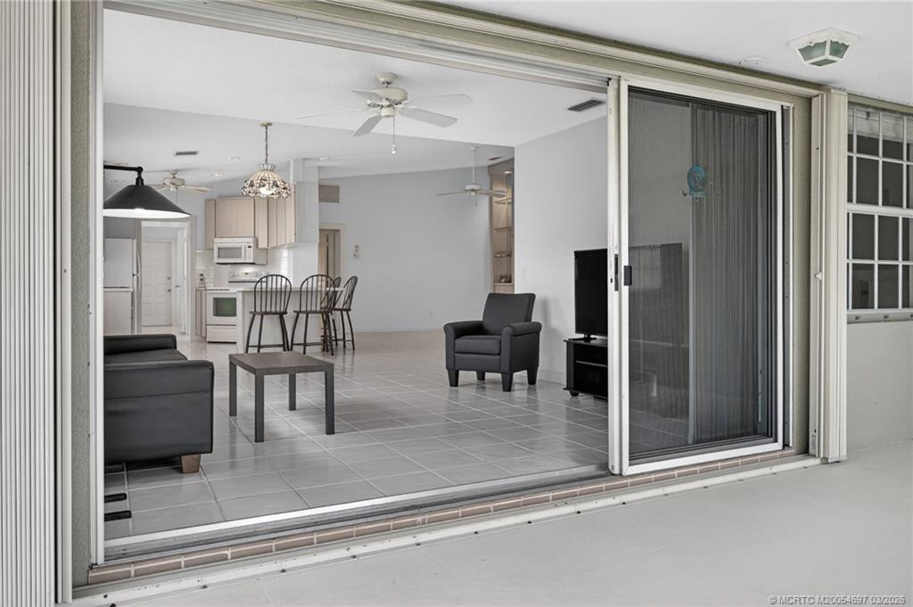 Large screened patio overlooking the sparkling lake
