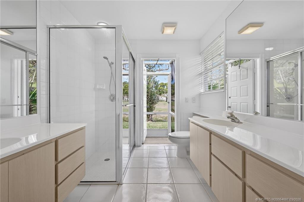 Exterior door open to small screened area.