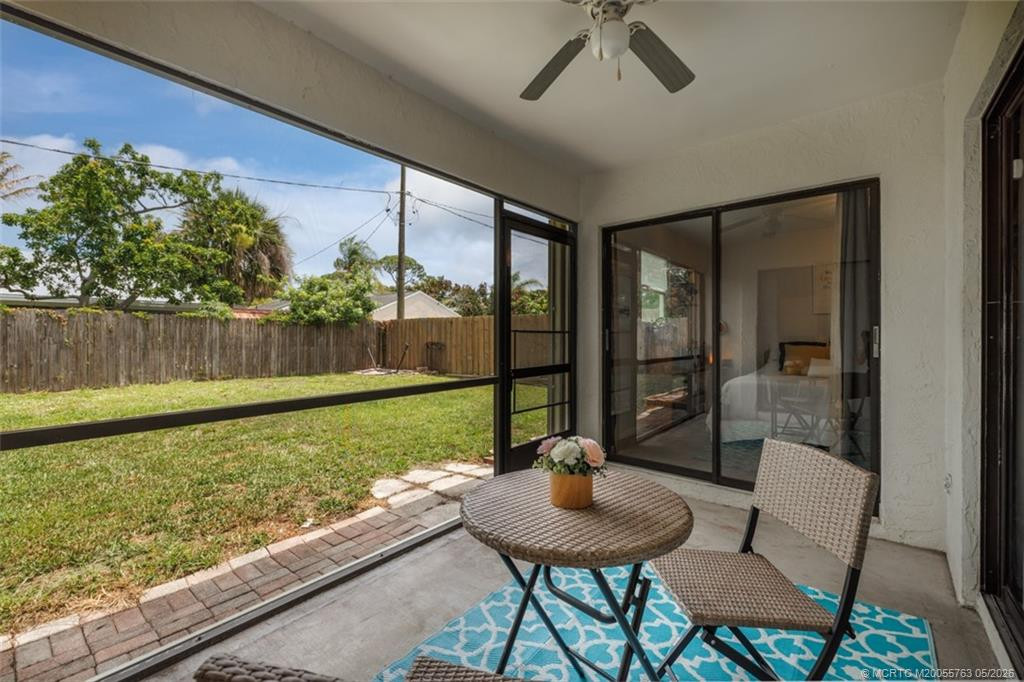 Patio overlooking fenced in backyard