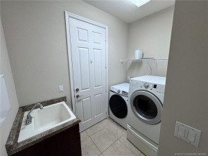 full laundry room off of the 2-car garage