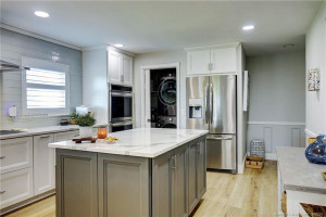 Kitchen toward washer/dryer on left
