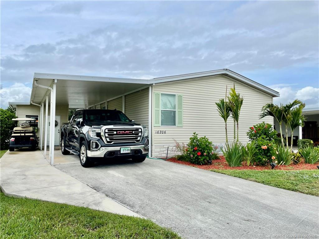 Driveway fits a large vehicle and brand new concrete cart path.