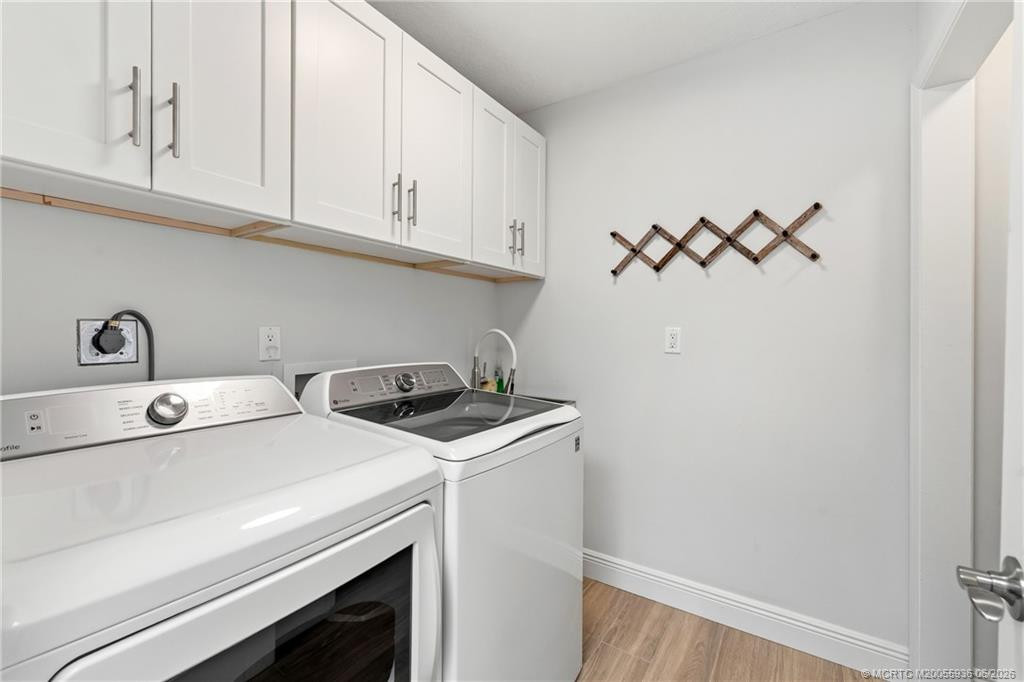 Laundry room with sink and storage.