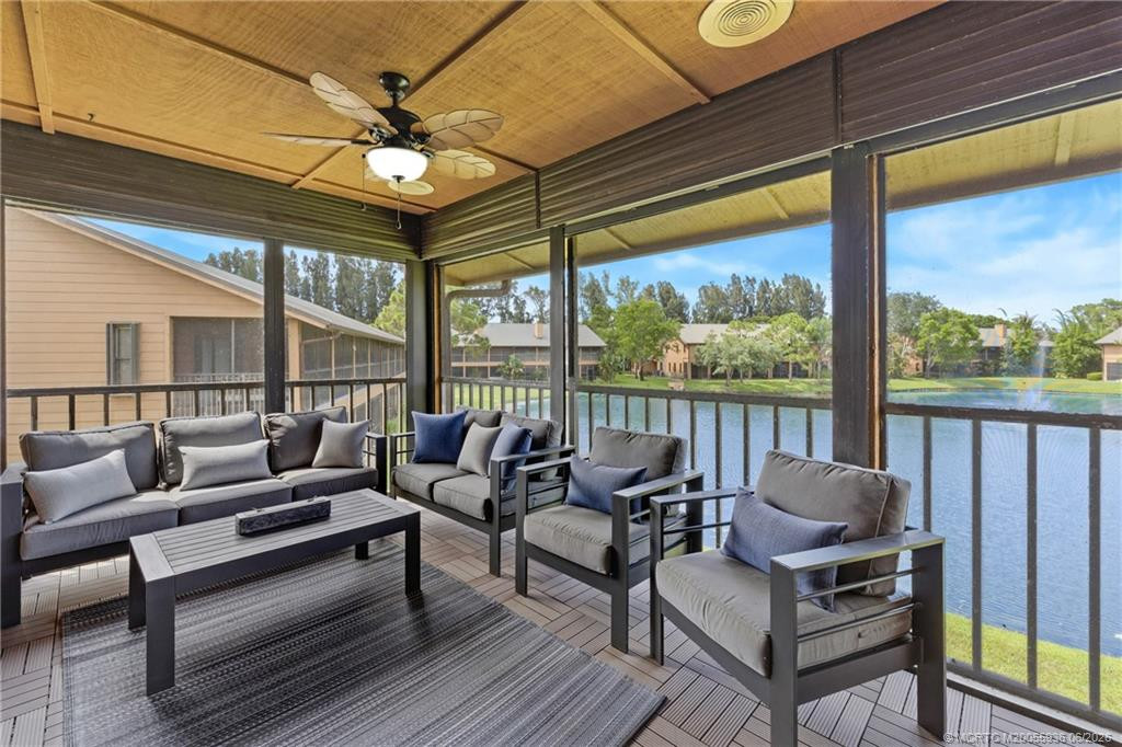 Screened balcony with lake views.