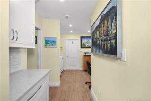 Hallway to Laundry Room, Guest Bedroom and Bathroom and Garage