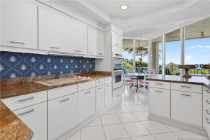 Granite counters complement the crisp white cabinets