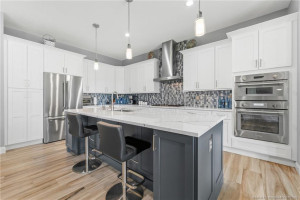 Chef's island kitchen with Thermador appliances.
