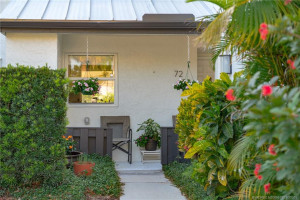 Flowers enhance the walkway to the front door