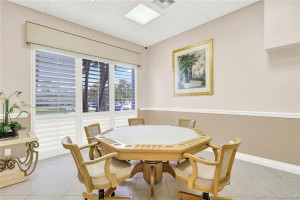This card playing table has its own room for your favorite card game.