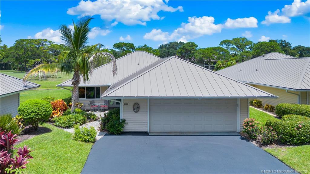 front with 1 1/2 car garage (car+golf cart)