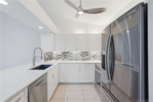 Updated kitchen with quartz countertops and stainless-steel appliances