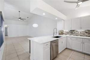 Updated kitchen with quartz countertops and stainless-steel appliances