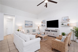 Virtually staged living space. Open floor plan, large living area with high ceilings.