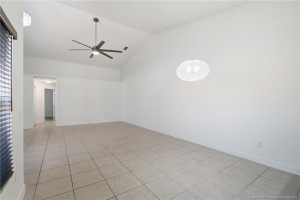 Open floor plan, large living area with high ceilings.