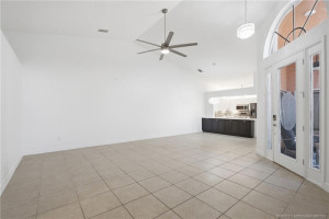 Open floor plan, large living area with high ceilings.