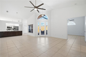 Open floor plan, large living area with high ceilings.