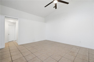Open floor plan, large living area with high ceilings.