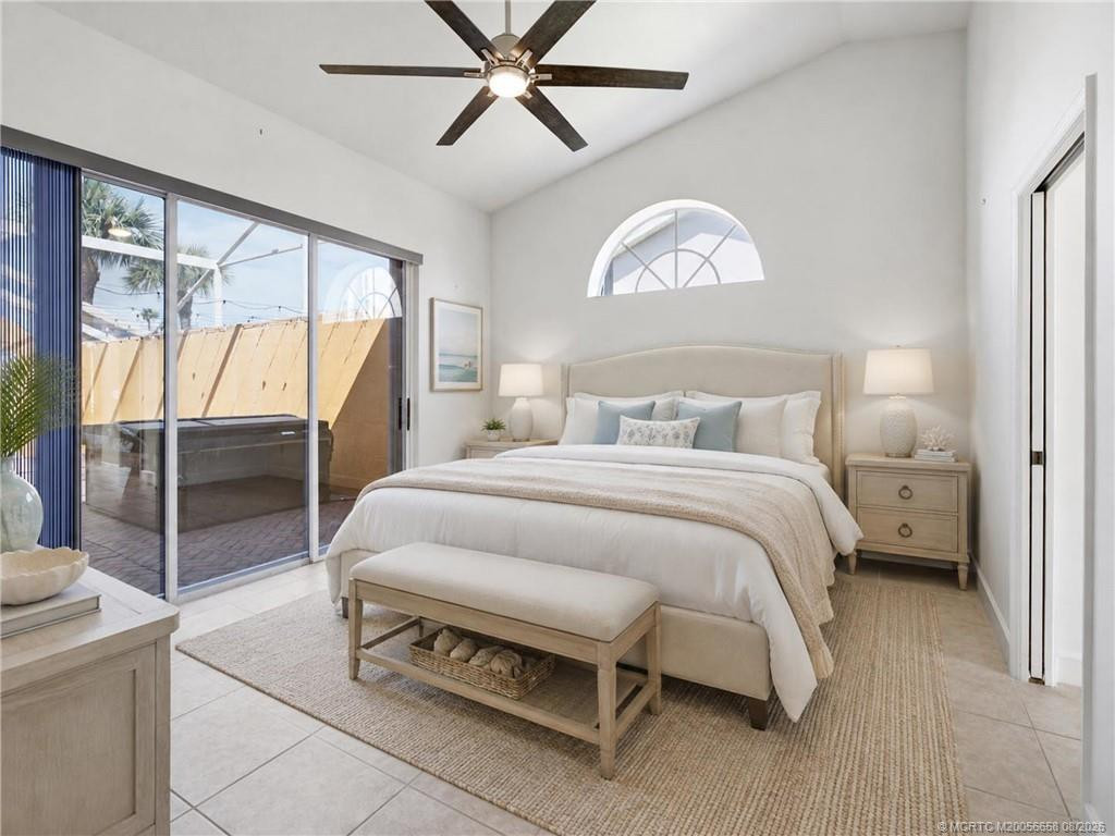 Virtually staged primary suite. Large room with lots of light and views of the patio.