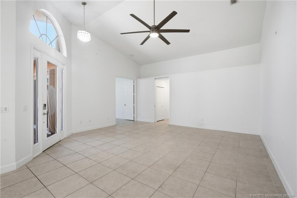 Open floor plan, large living area with high ceilings.