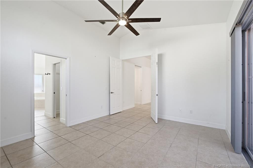 Large primary suite with lots of light and views of the patio.