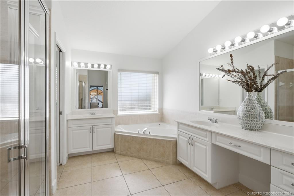 Primary bathroom with walk-in shower and soaking tub.