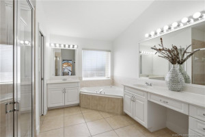 Primary bathroom with walk-in shower and soaking tub.