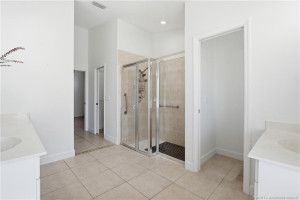 Primary bathroom with walk-in shower and soaking tub.
