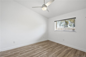 2nd Bedroom: large space with luxury vinyl plank flooring and views of green space.