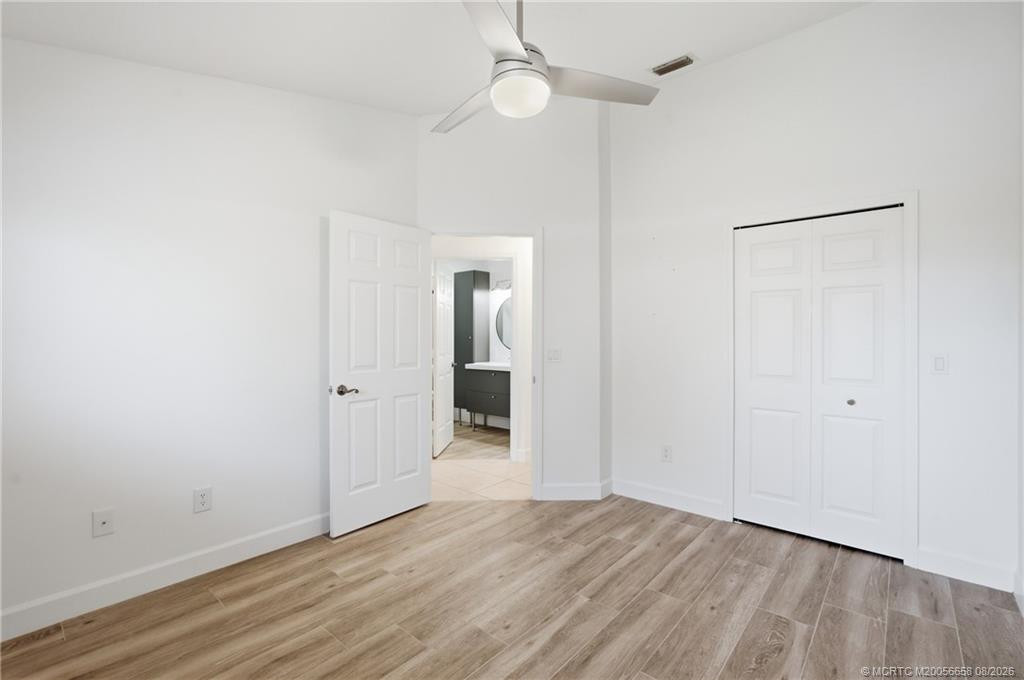 2nd Bedroom: large space with luxury vinyl plank flooring and views of green space.
