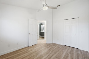 2nd Bedroom: large space with luxury vinyl plank flooring and views of green space.